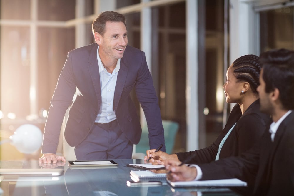 Emotionally intelligent leader at a conference table