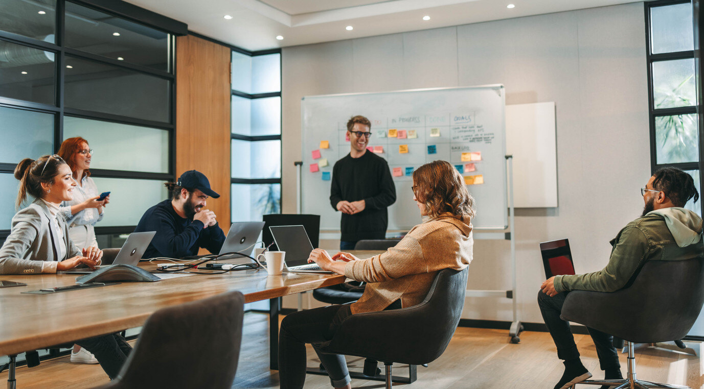 Employees in a colorful conference room