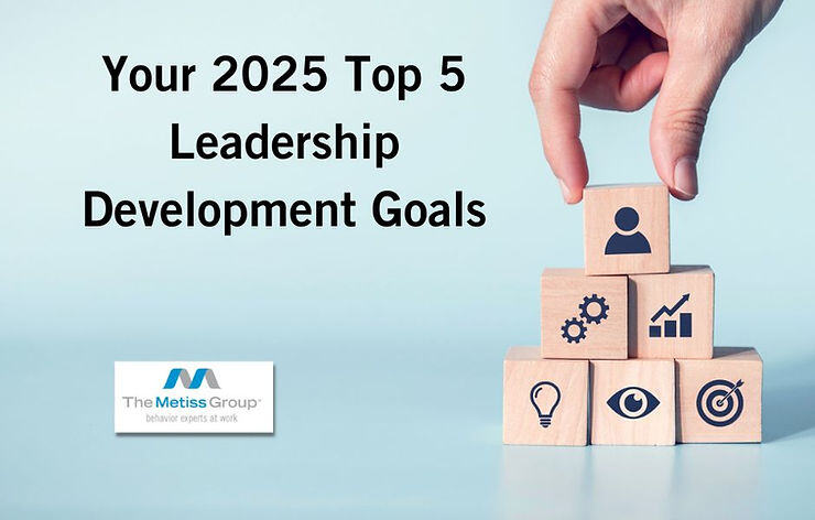 Image of hand stacking leadership blocks with blog title in bold text "Your 2025 Top 5 Leadership Development Goals"