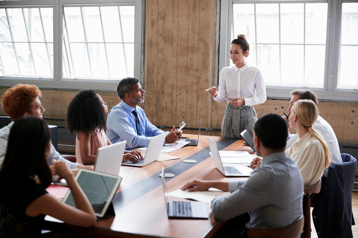 Employee leading a meeting in coference room